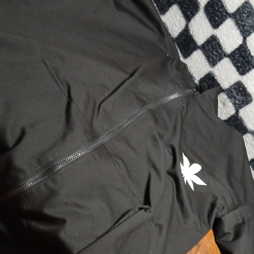 Black Jacket with White Leaf Logo